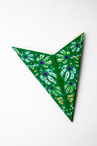 Mari Green embroidered paper star folded up, out of the package