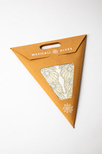 Mari White embroidered paper star, folded up, in packaging
