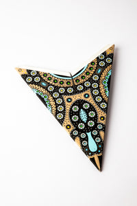 Rajasthani Black Gold embroidered paper star folded up, out of the package