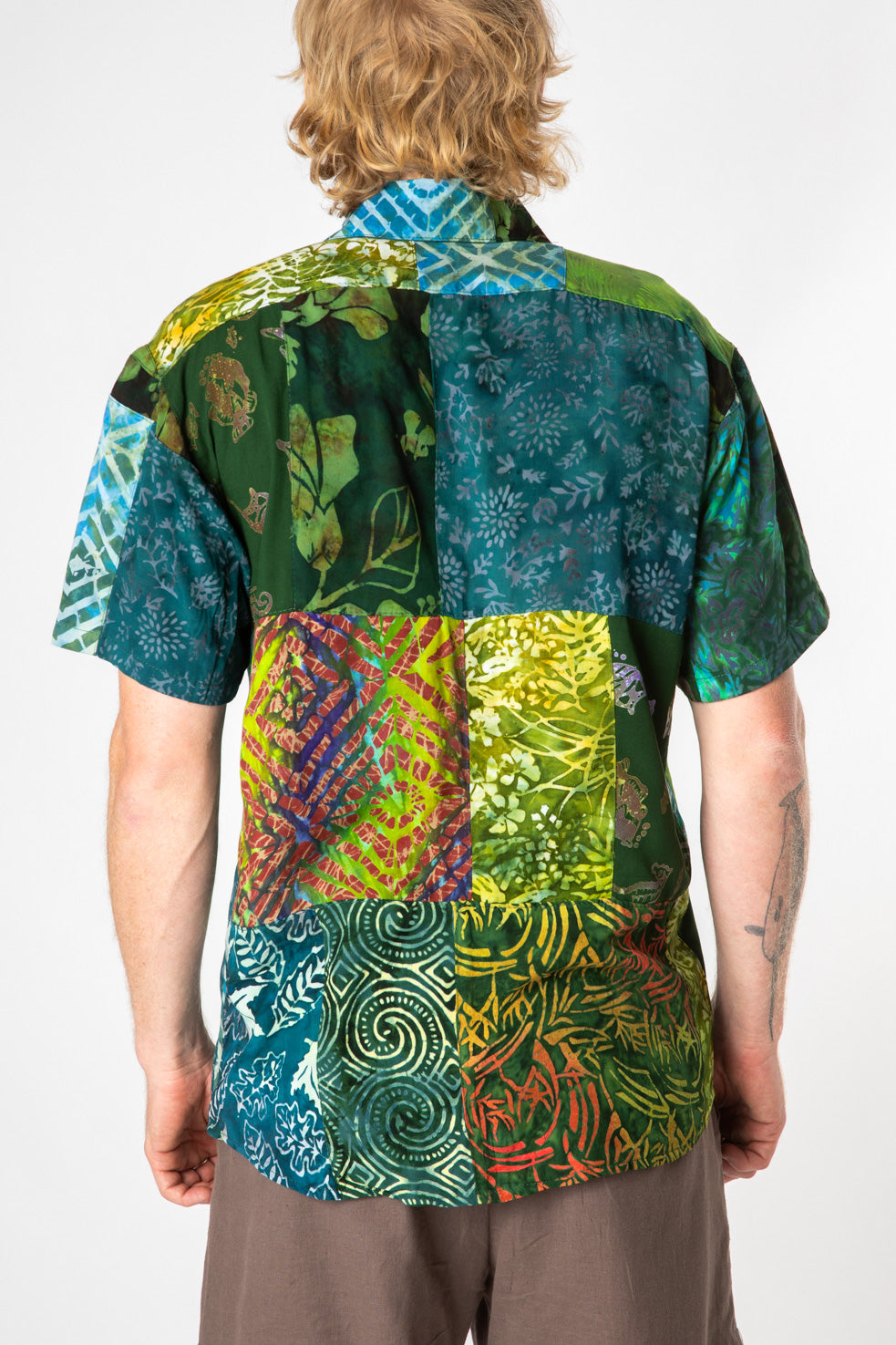 Chauncey is wearing size L patchwork button up shirt in green