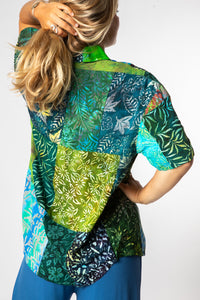 Sophie is wearing size M patchwork button up shirt in green