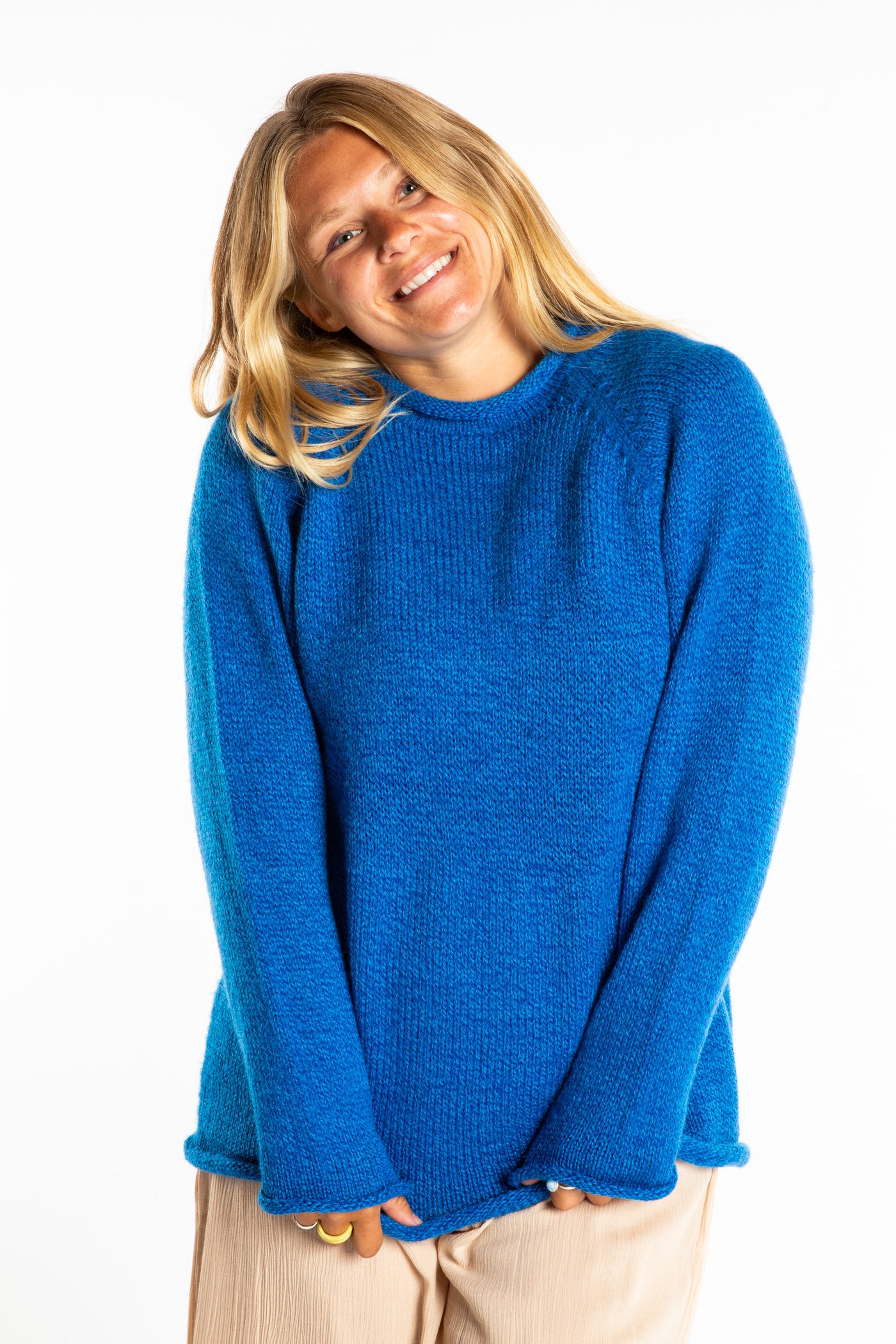 Sophie wearing a size Medium Blueberry fisherman style sweater 