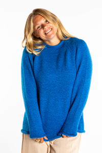Sophie wearing a size Medium Blueberry fisherman style sweater 