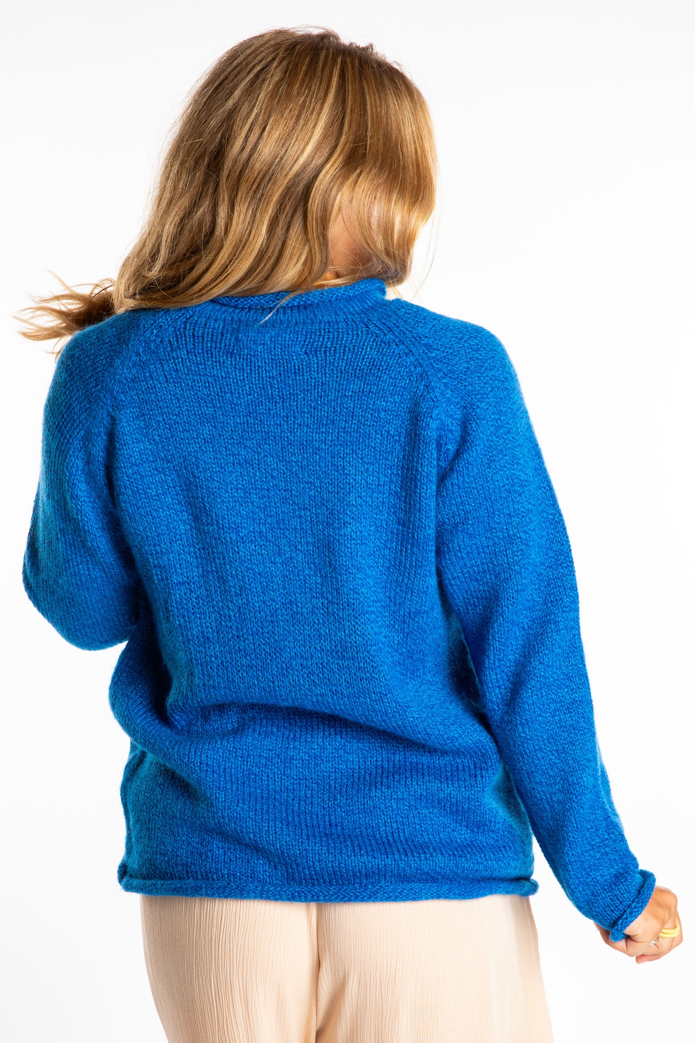 Sophie wearing a size Medium Blueberry fisherman style sweater 
