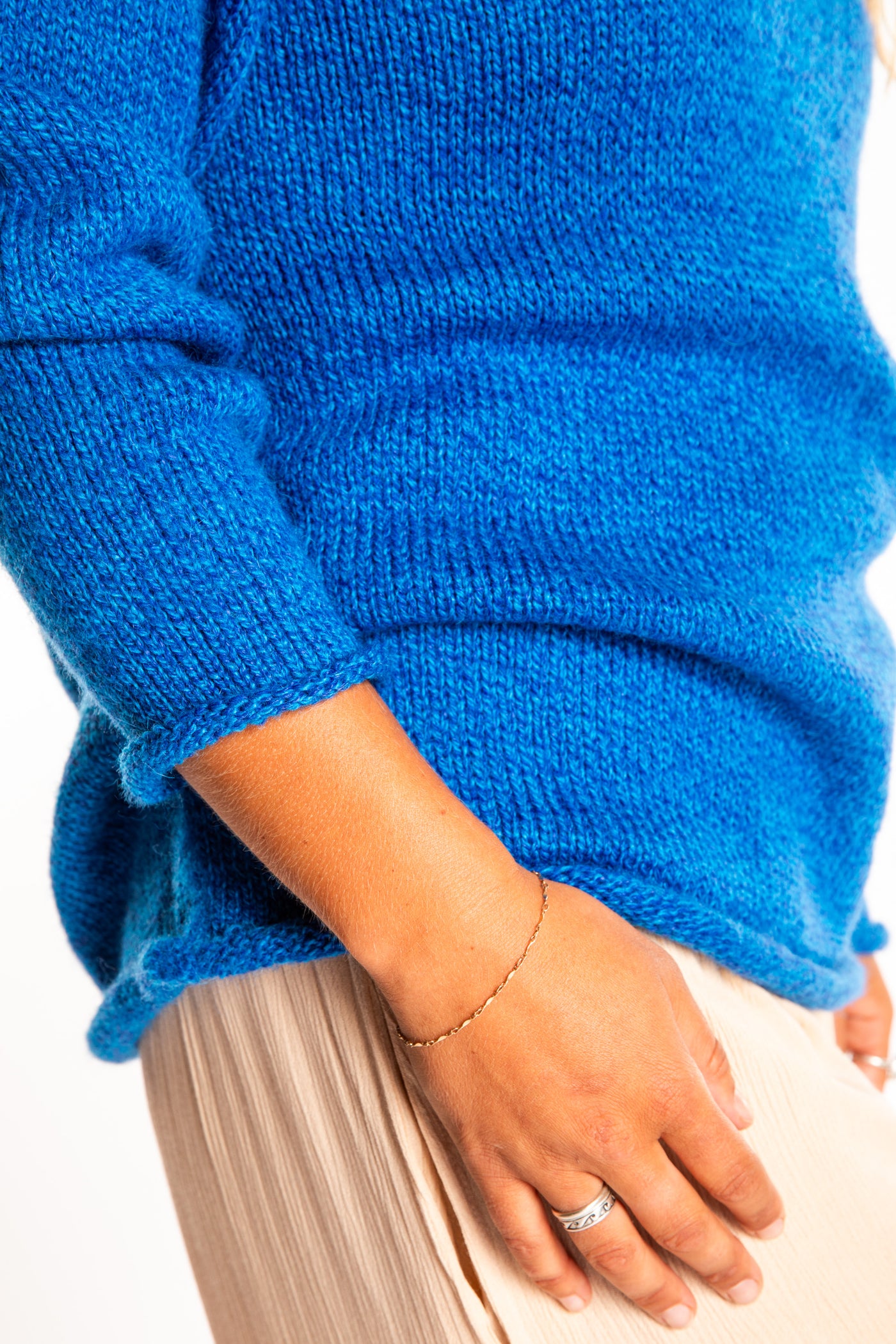 Sophie wearing a size Medium Blueberry fisherman style sweater 