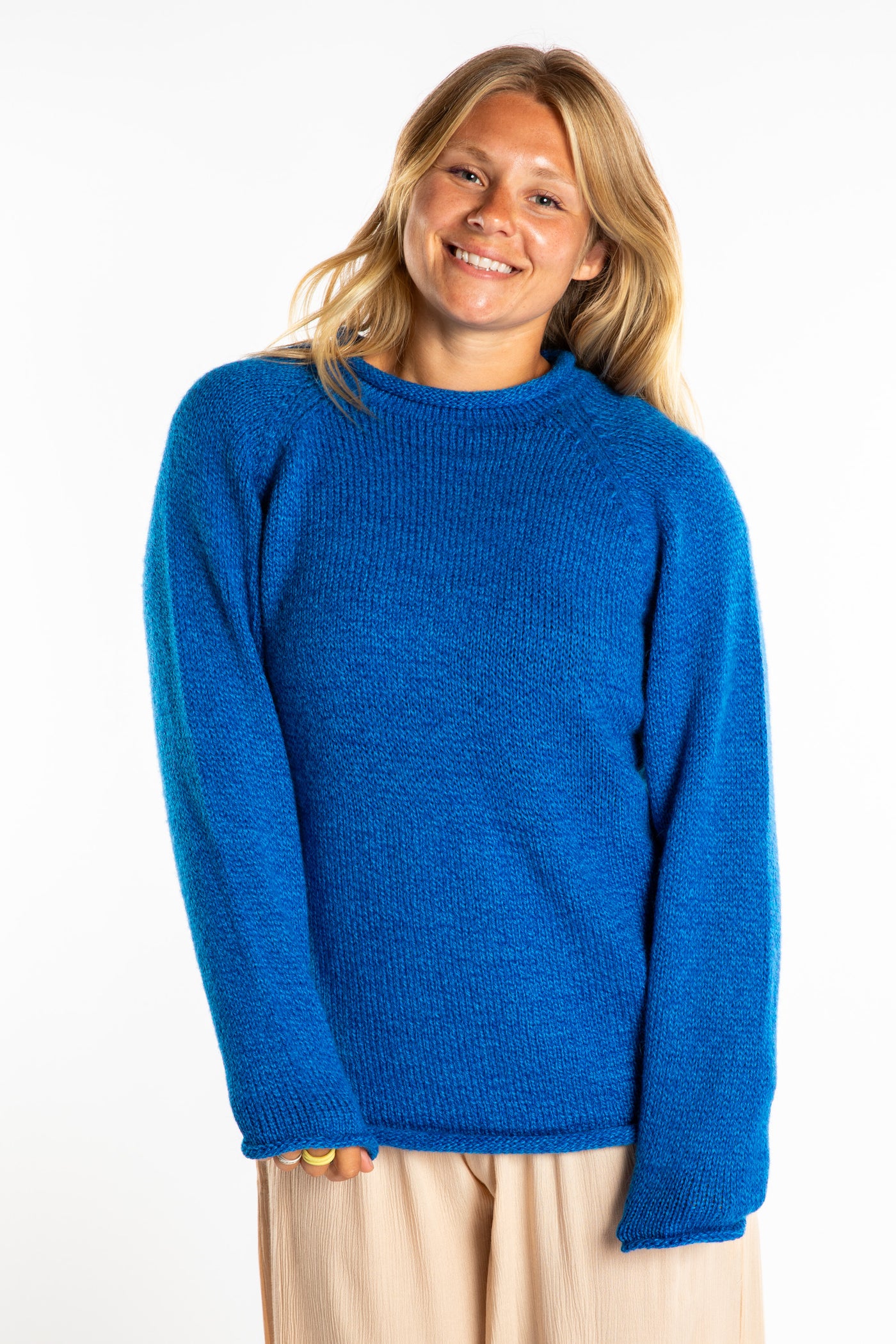 Sophie wearing a size Medium Blueberry fisherman style sweater 