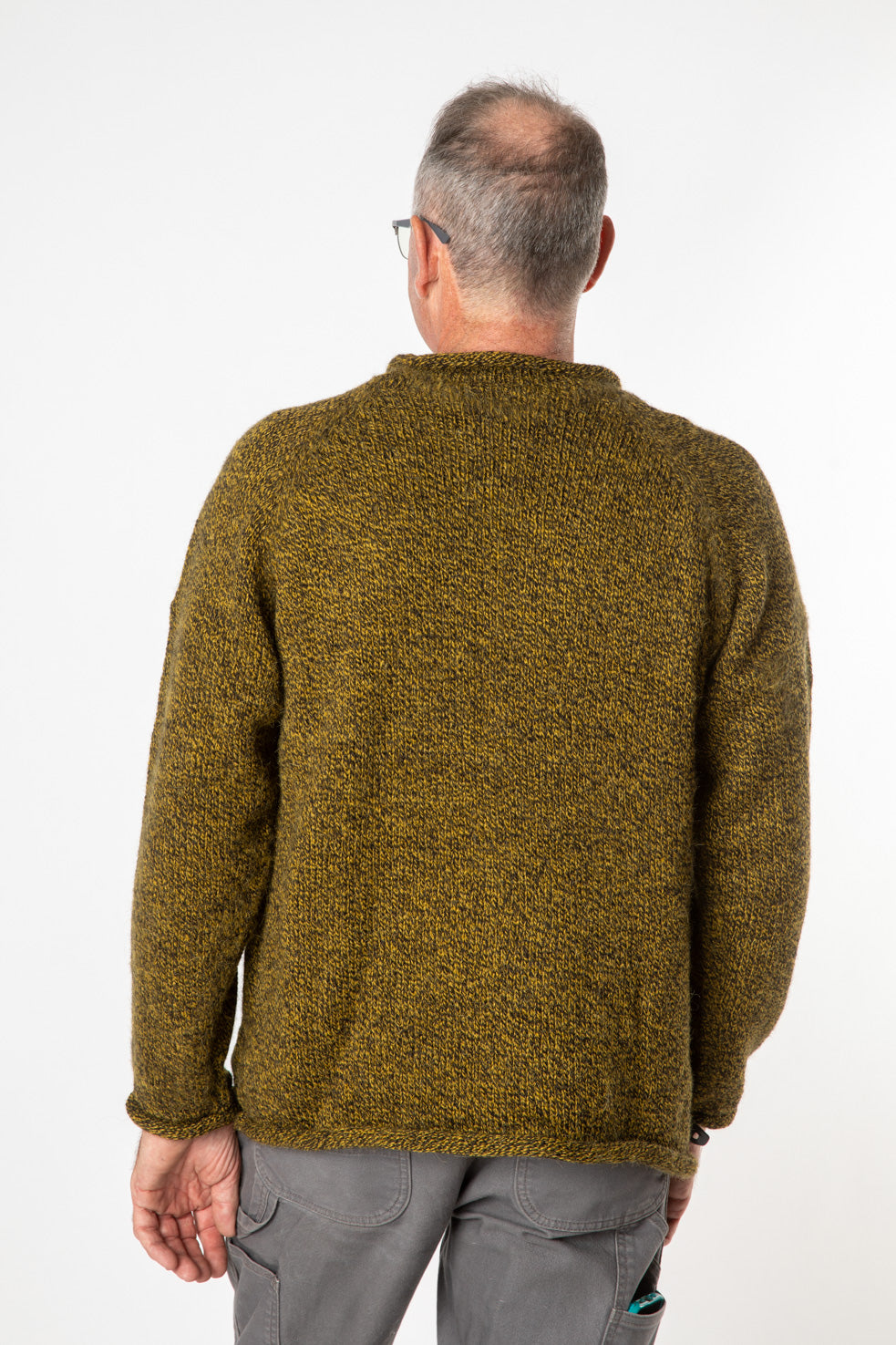 Ross is wearing size L roll neck alpaca sweater in bumblebee