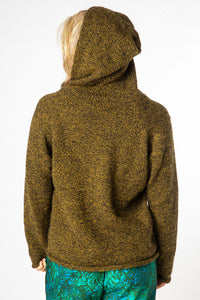 Sophie, wearing size Medium, wearing a Bumblebee alpaca wool pullover with a hood.