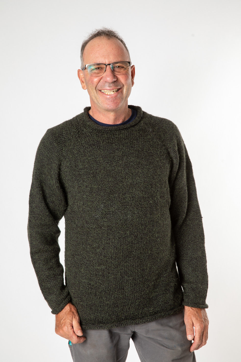 Ross is wearing size L roll neck alpaca sweater in dark green