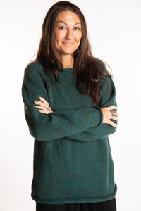 Jen wearing a size large Emerald fisherman style sweater 