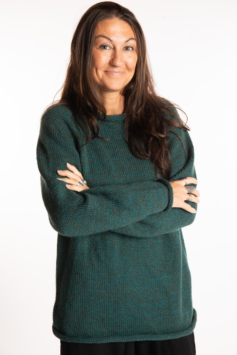 Jen wearing a size large Emerald fisherman style sweater 