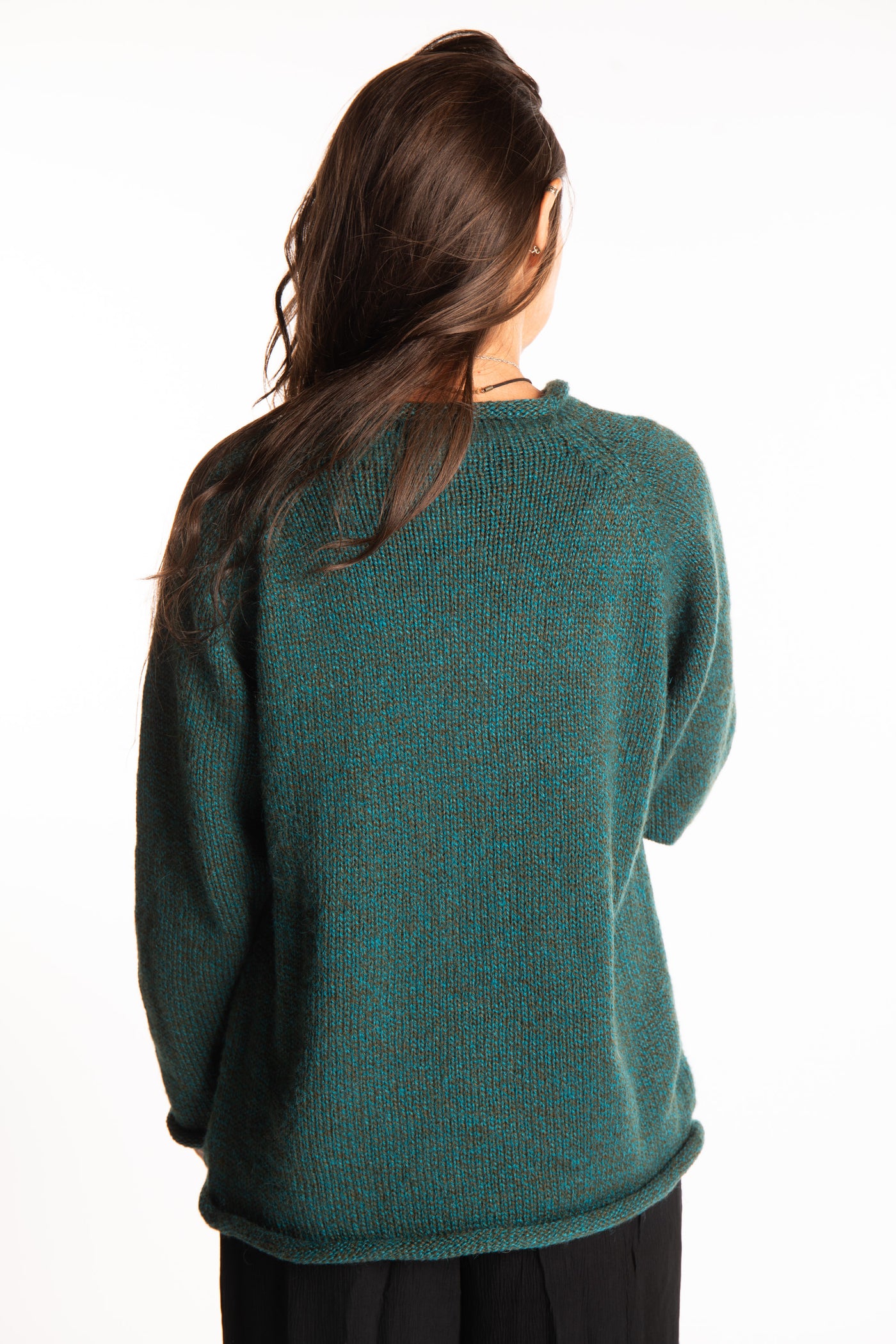 Jen wearing a size large Emerald fisherman style sweater 