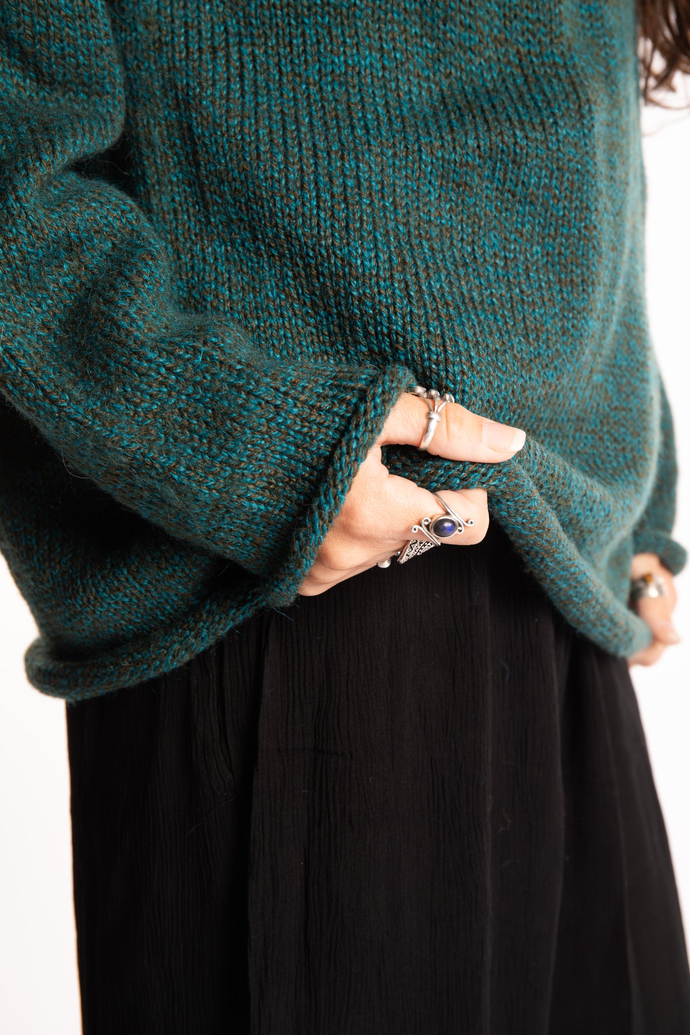 Jen wearing a size large Emerald fisherman style sweater 