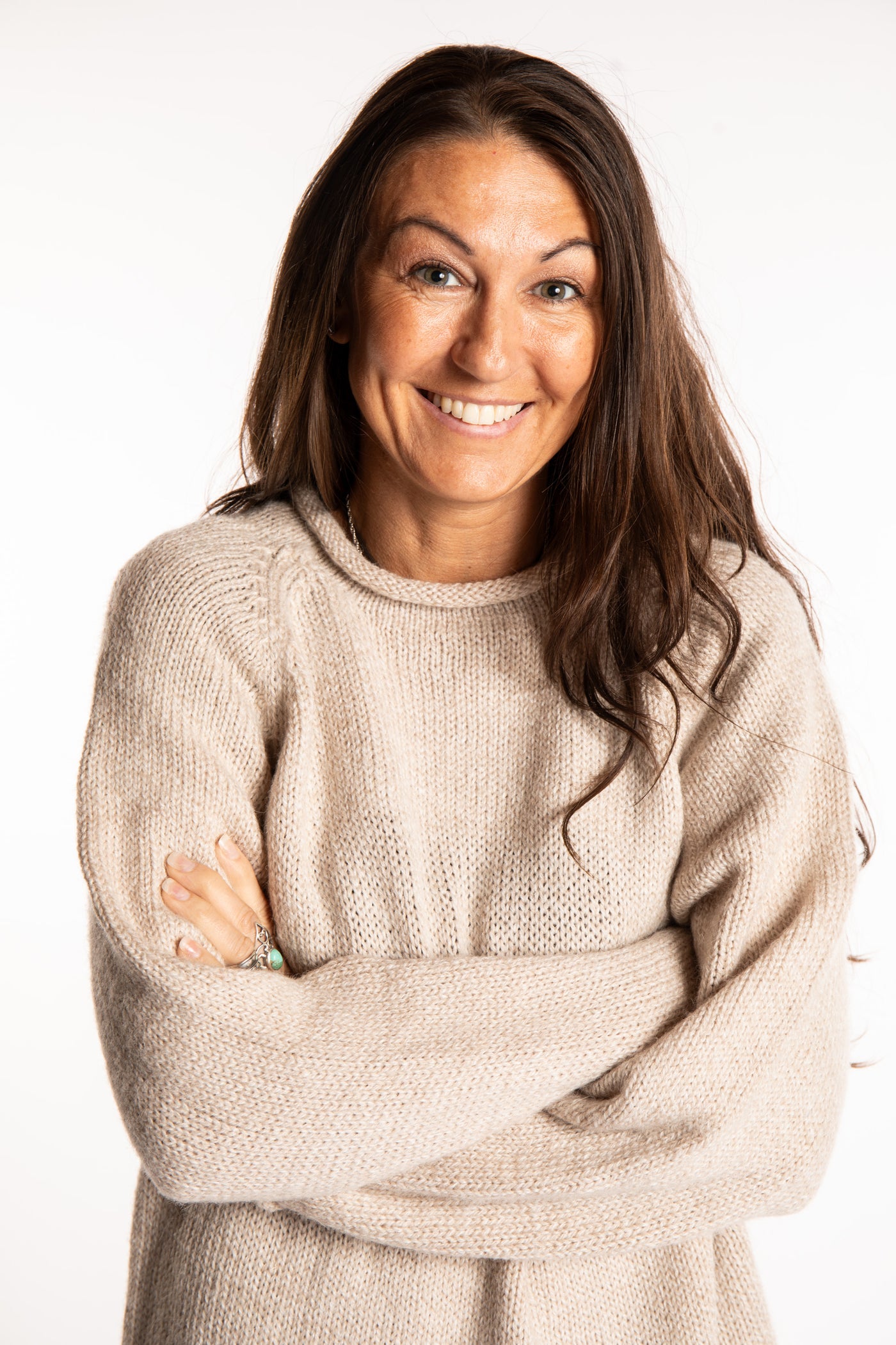 Jen wearing a size large oatmeal fisherman style sweater 