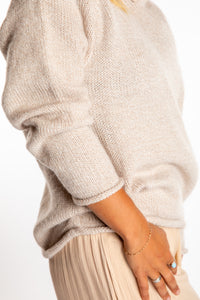 Sophie is wearing size M alpaca hoodie in Oatmeal