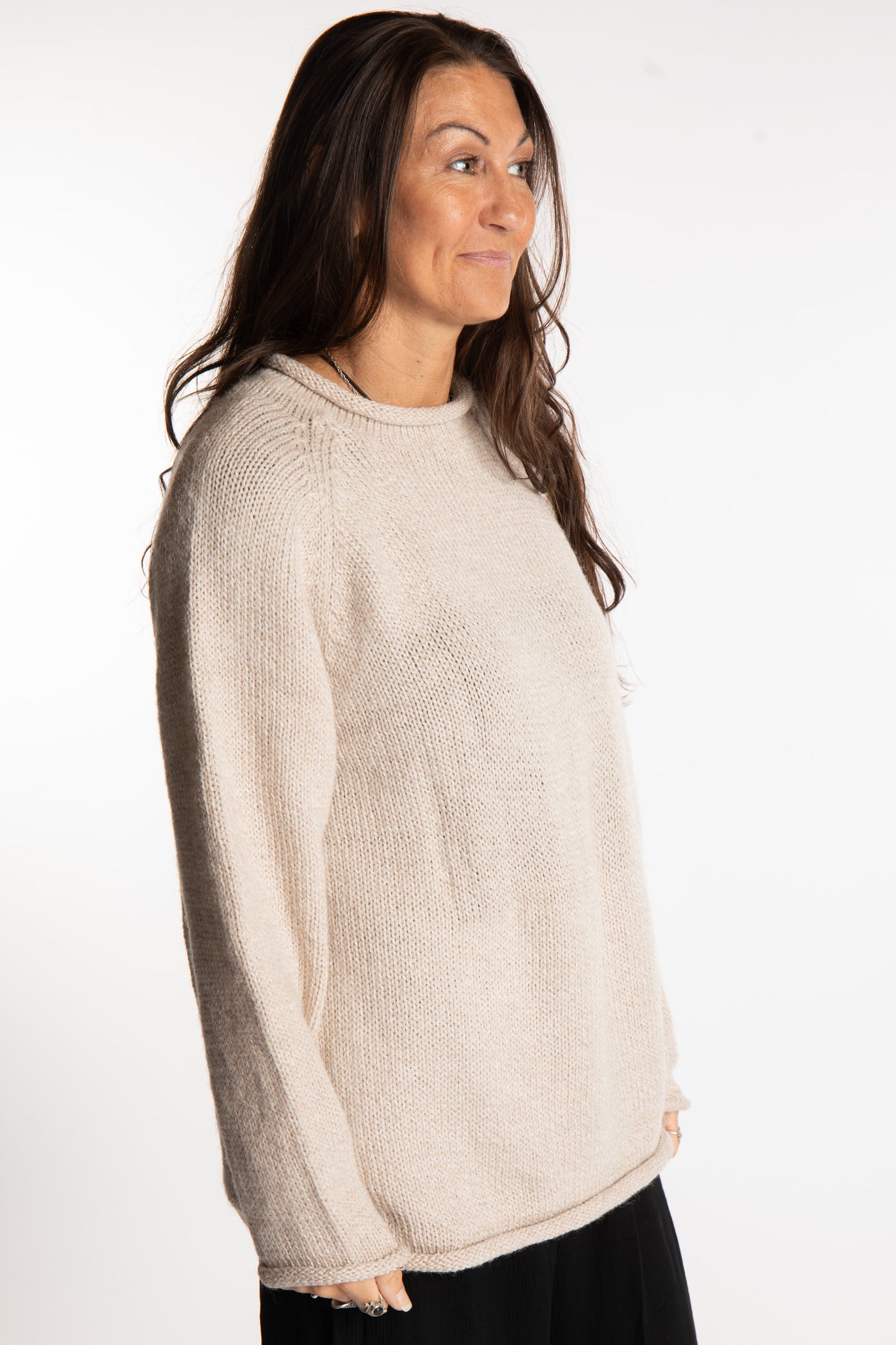 Jen wearing a size large oatmeal fisherman style sweater 