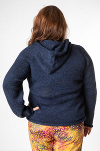 Nicole is wearing size XL alpaca hoodie in navy
