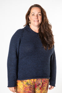 Nicole is wearing size XL alpaca hoodie in navy