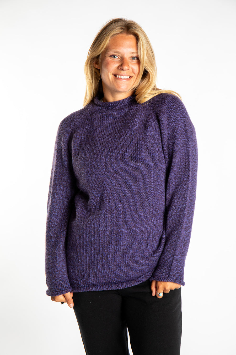 Sophie is wearing size S roll neck alpaca sweater in purple