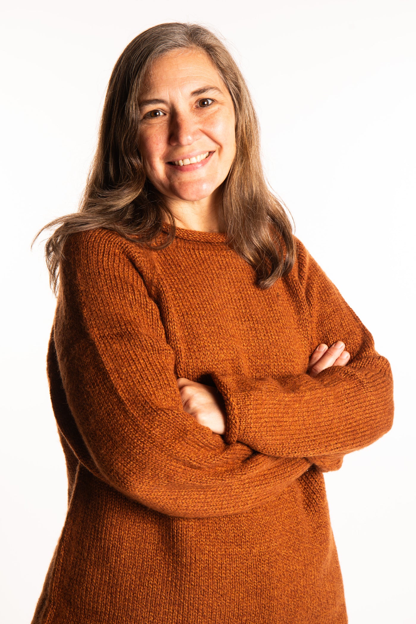 Holly wearing a size Large Rust fisherman style sweater 