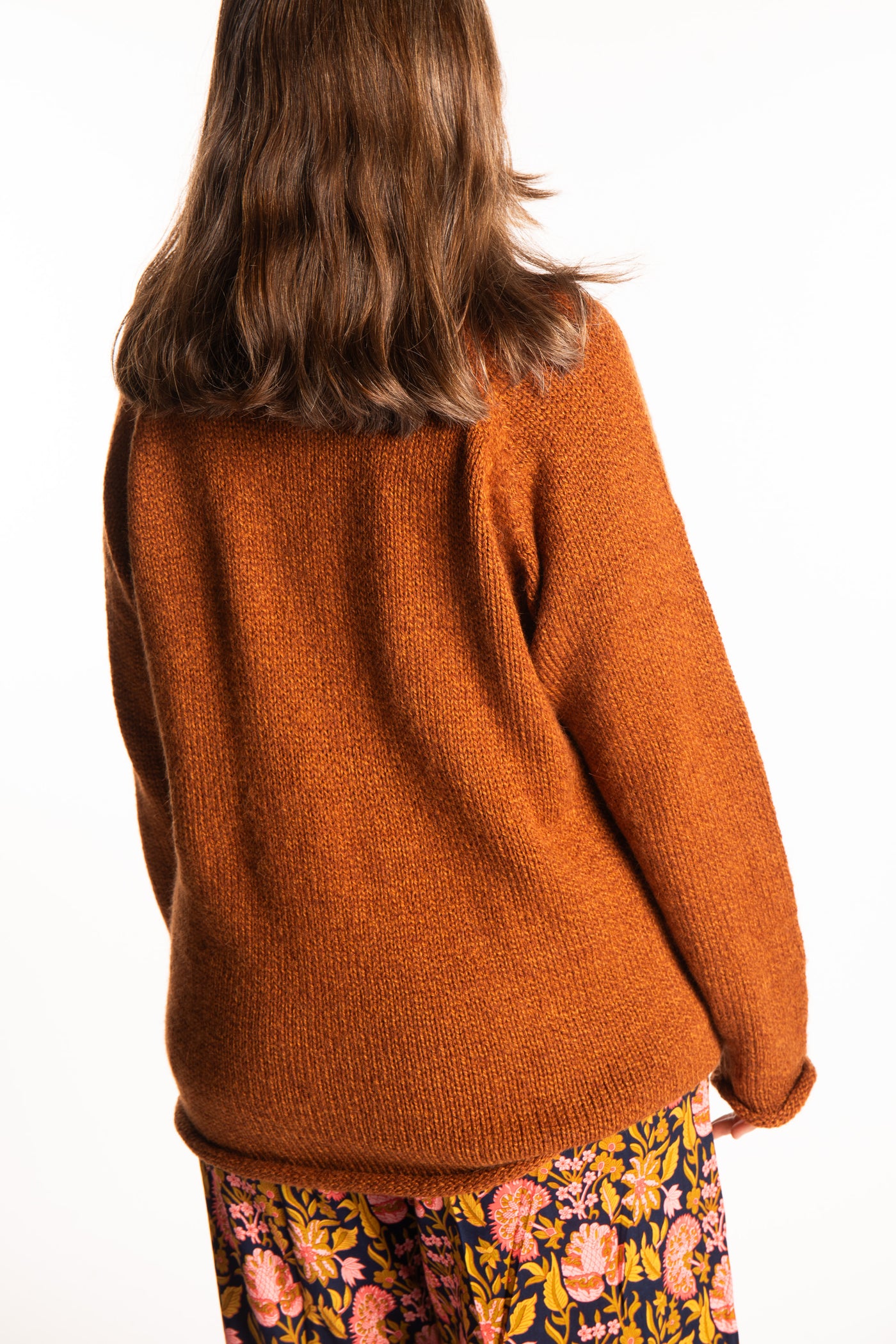 Holly wearing a size Large Rust fisherman style sweater 