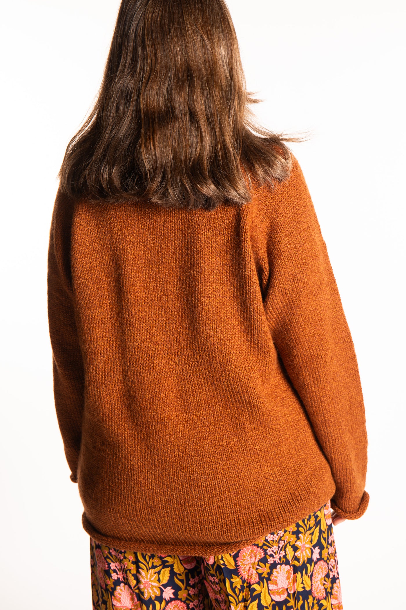 Holly wearing a size Large Rust fisherman style sweater 