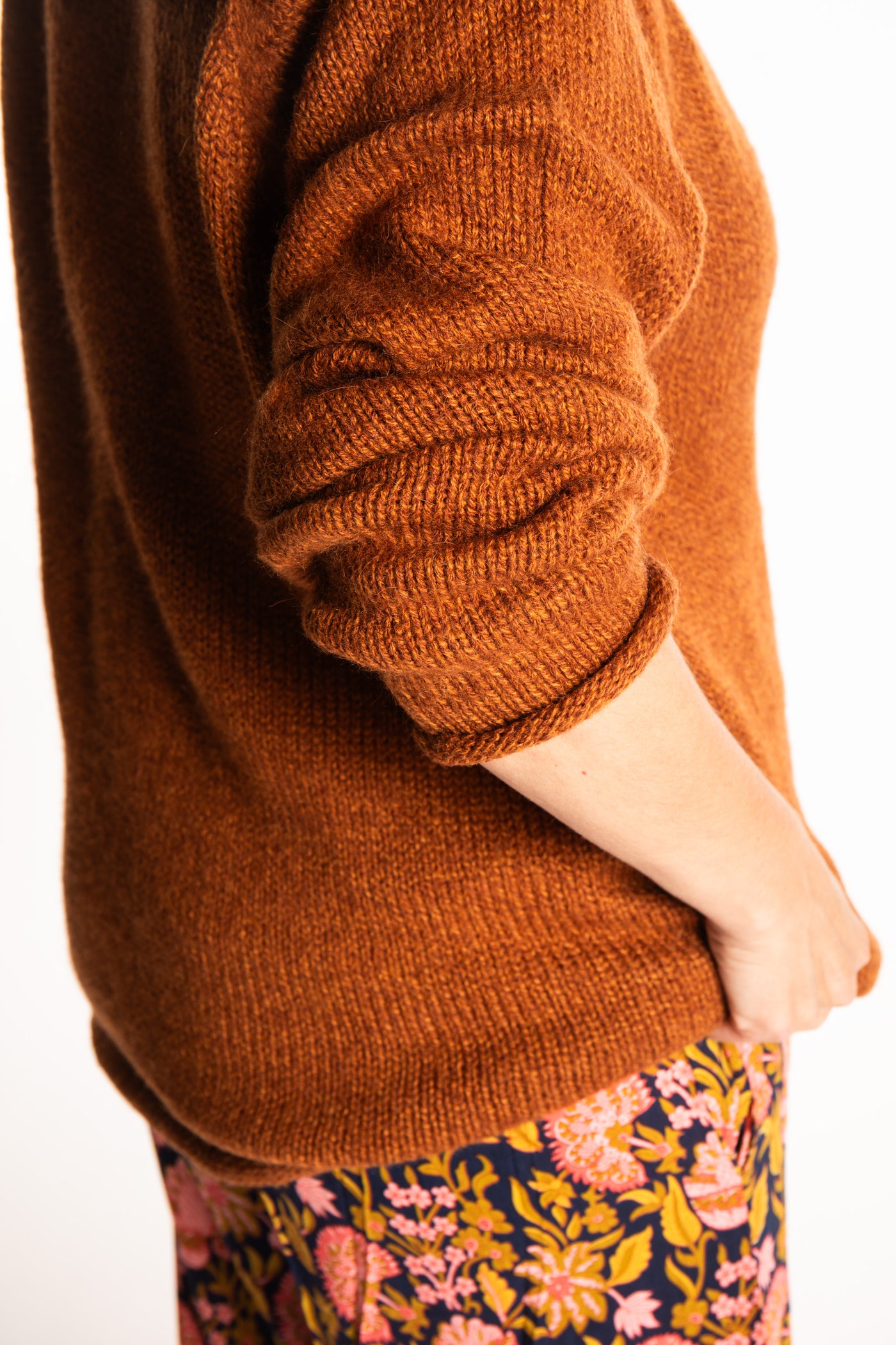 Holly wearing a size Large Rust fisherman style sweater 