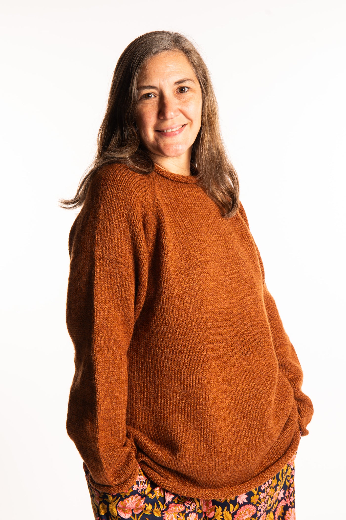 Holly wearing a size Large Rust fisherman style sweater 