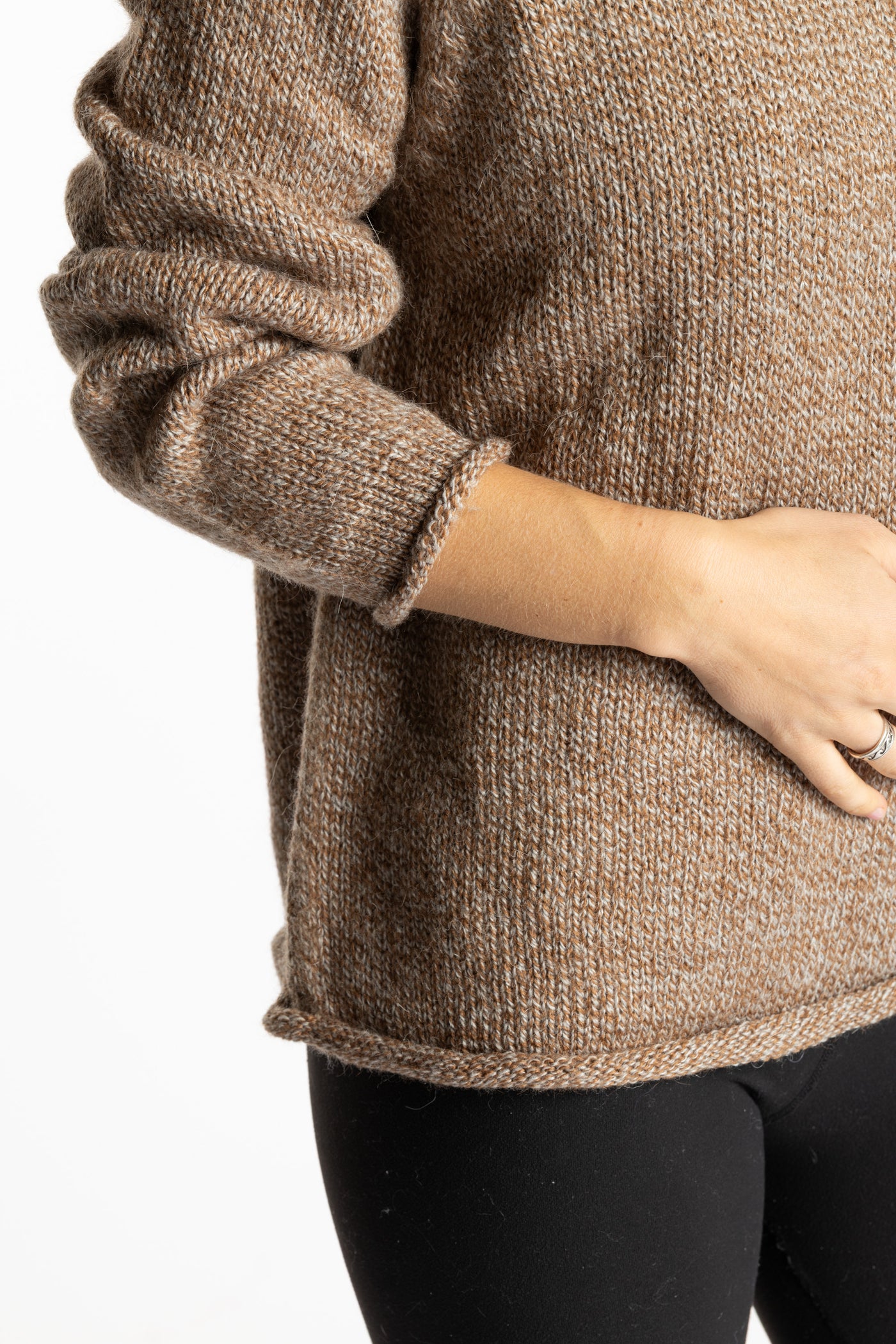 Sophie is wearing the Tan Classic Unisex Alpaca Wool Sweater in size S