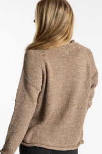 Sophie is wearing the Tan Classic Unisex Alpaca Wool Sweater in size S