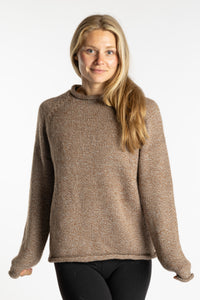 Sophie is wearing the Tan Classic Unisex Alpaca Wool Sweater in size S