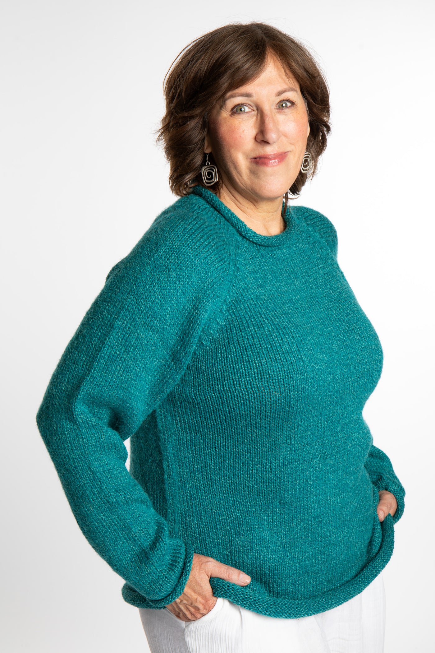 Betty wearing a size L Teal roll neck fisherman-style sweater