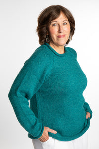 Betty wearing a size L Teal roll neck fisherman-style sweater