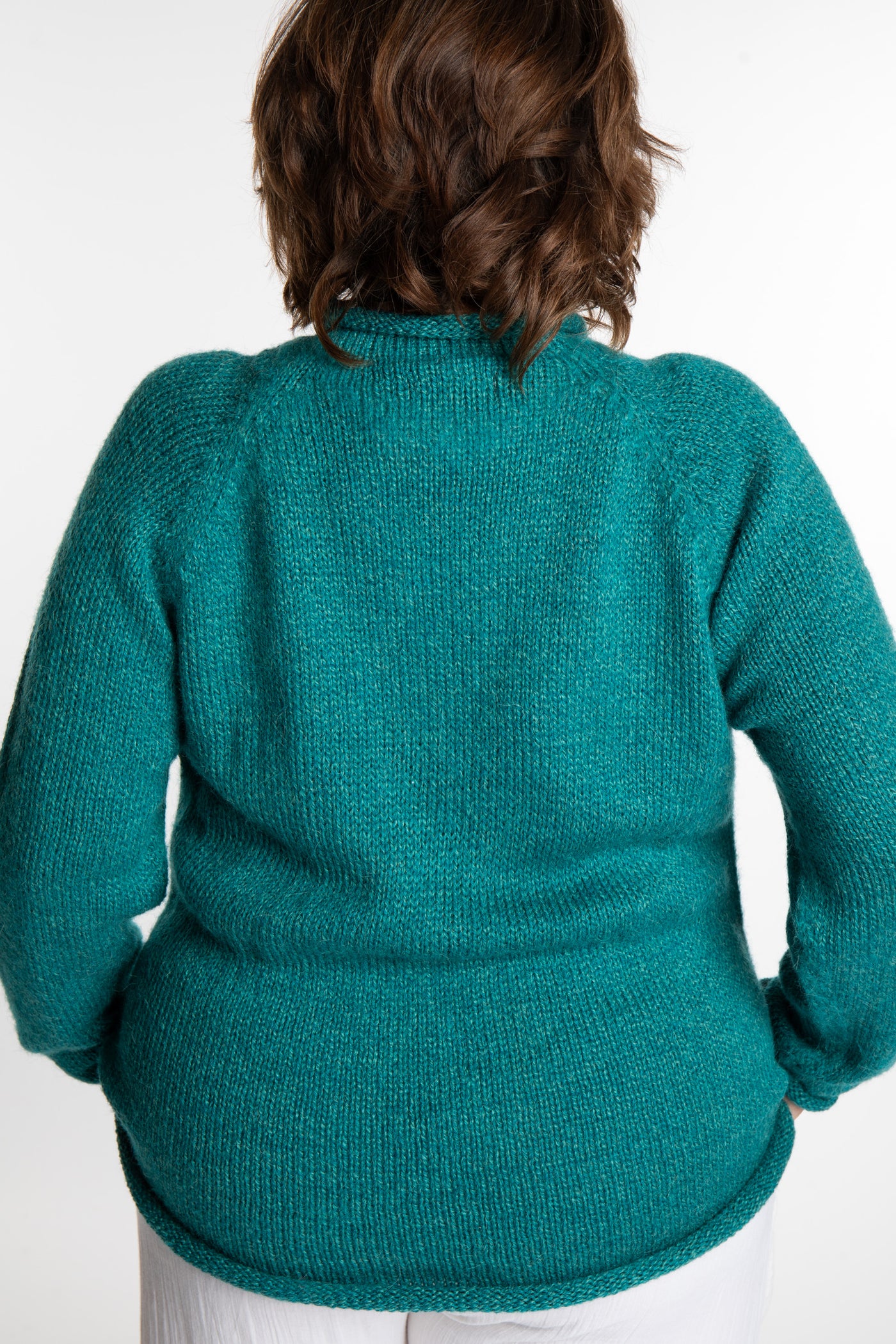 Betty wearing a size L Teal roll neck fisherman-style sweater