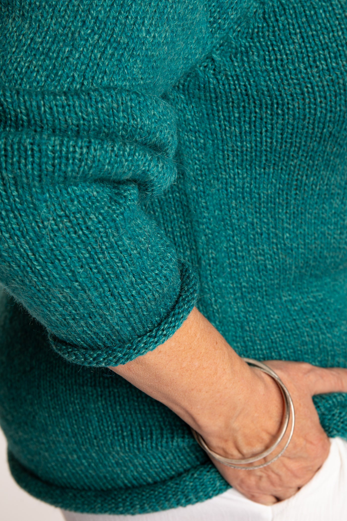 Betty wearing a size L Teal roll neck fisherman-style sweater
