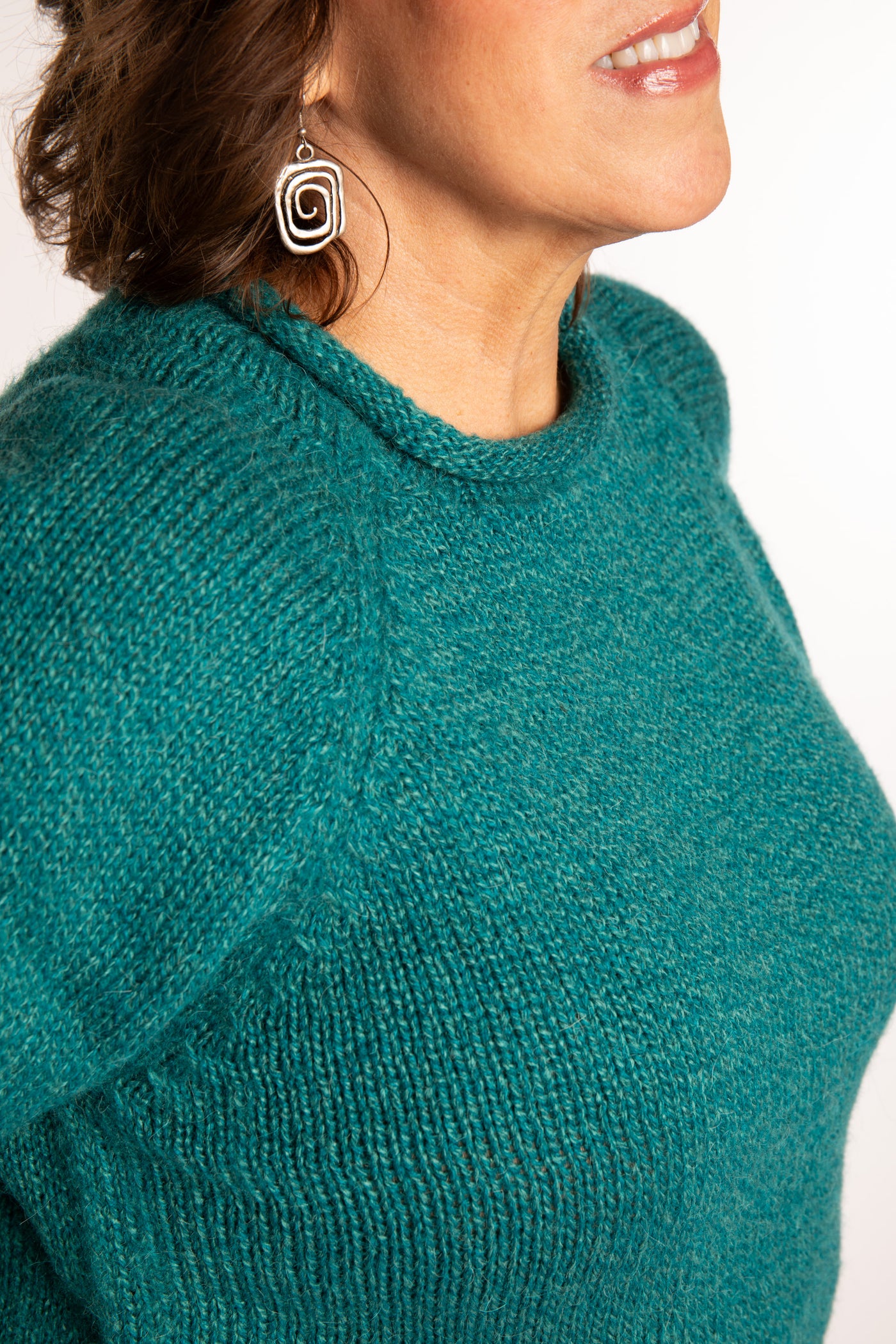 Betty wearing a size L Teal roll neck fisherman-style sweater