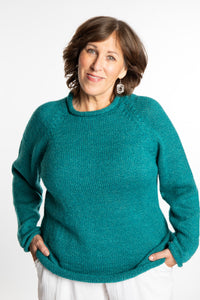 Betty wearing a size L Teal roll neck fisherman-style sweater
