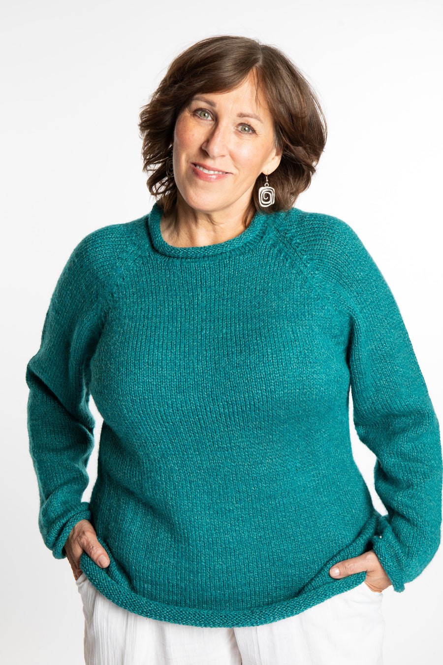 Betty wearing a size L Teal roll neck fisherman-style sweater