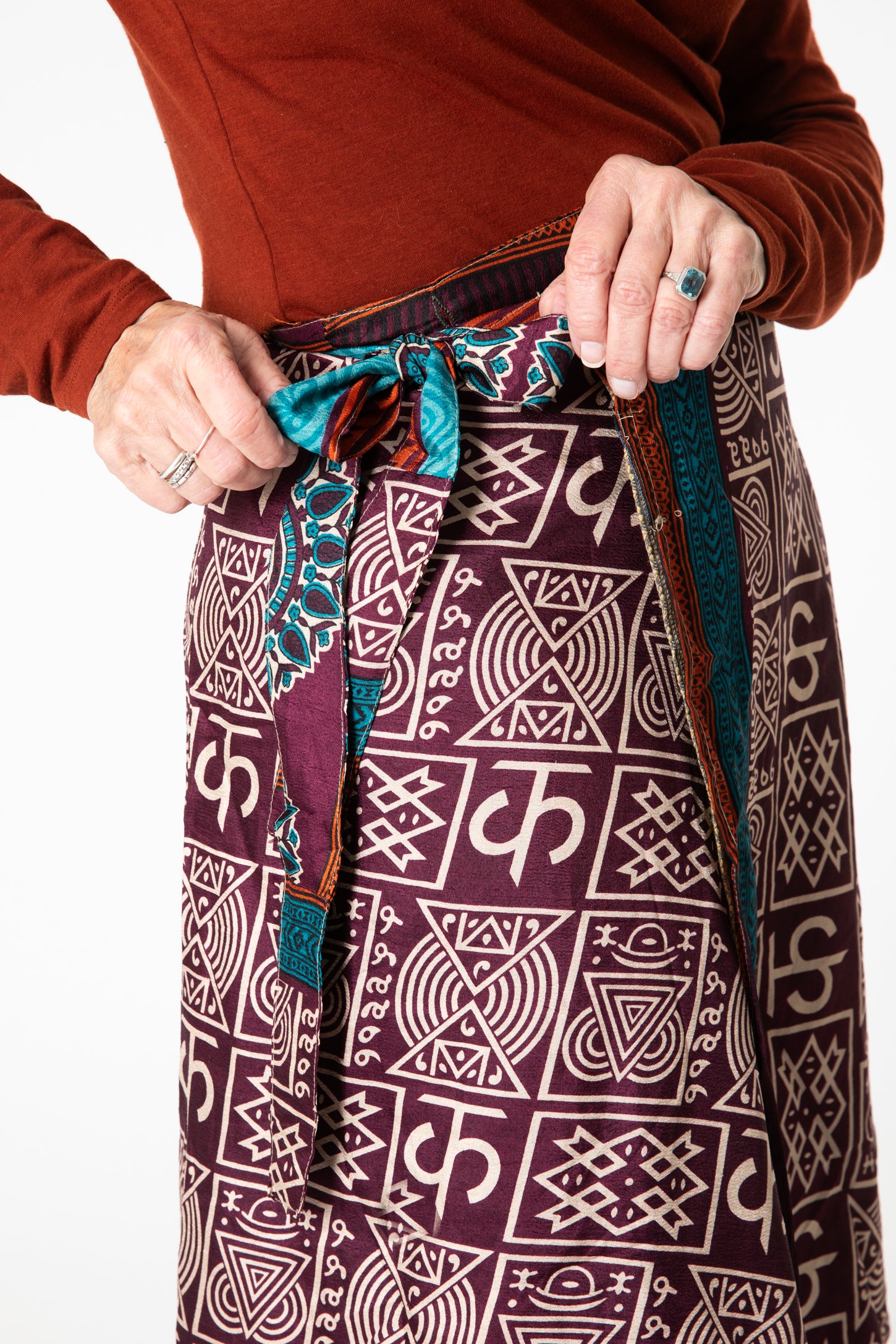 Toni is wearing a silk wrap skirt in dark star
