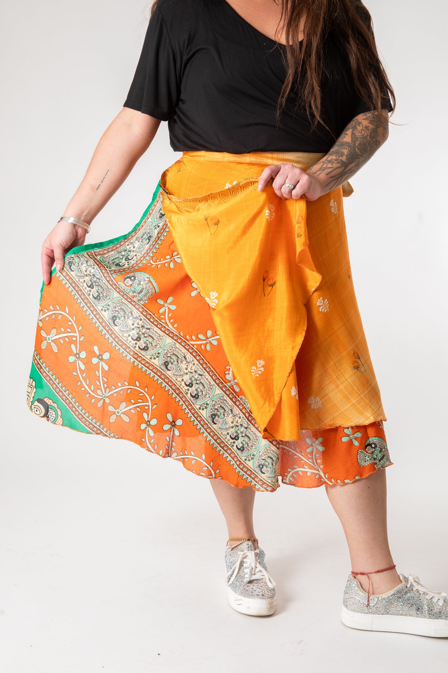 Desiree is wearing a silk wrap skirt in fire on the mountain