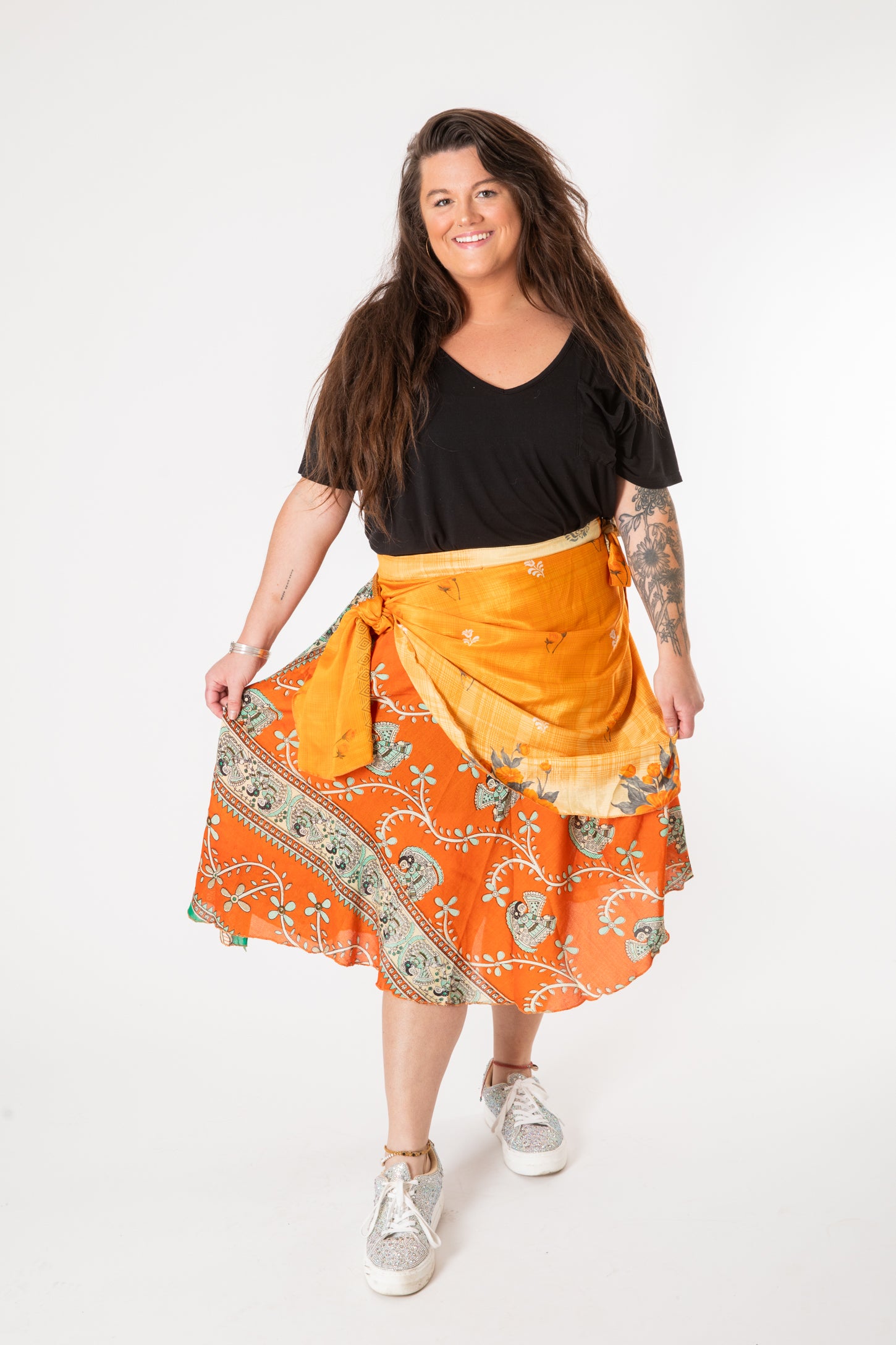 Desiree is wearing a silk wrap skirt in fire on the mountain