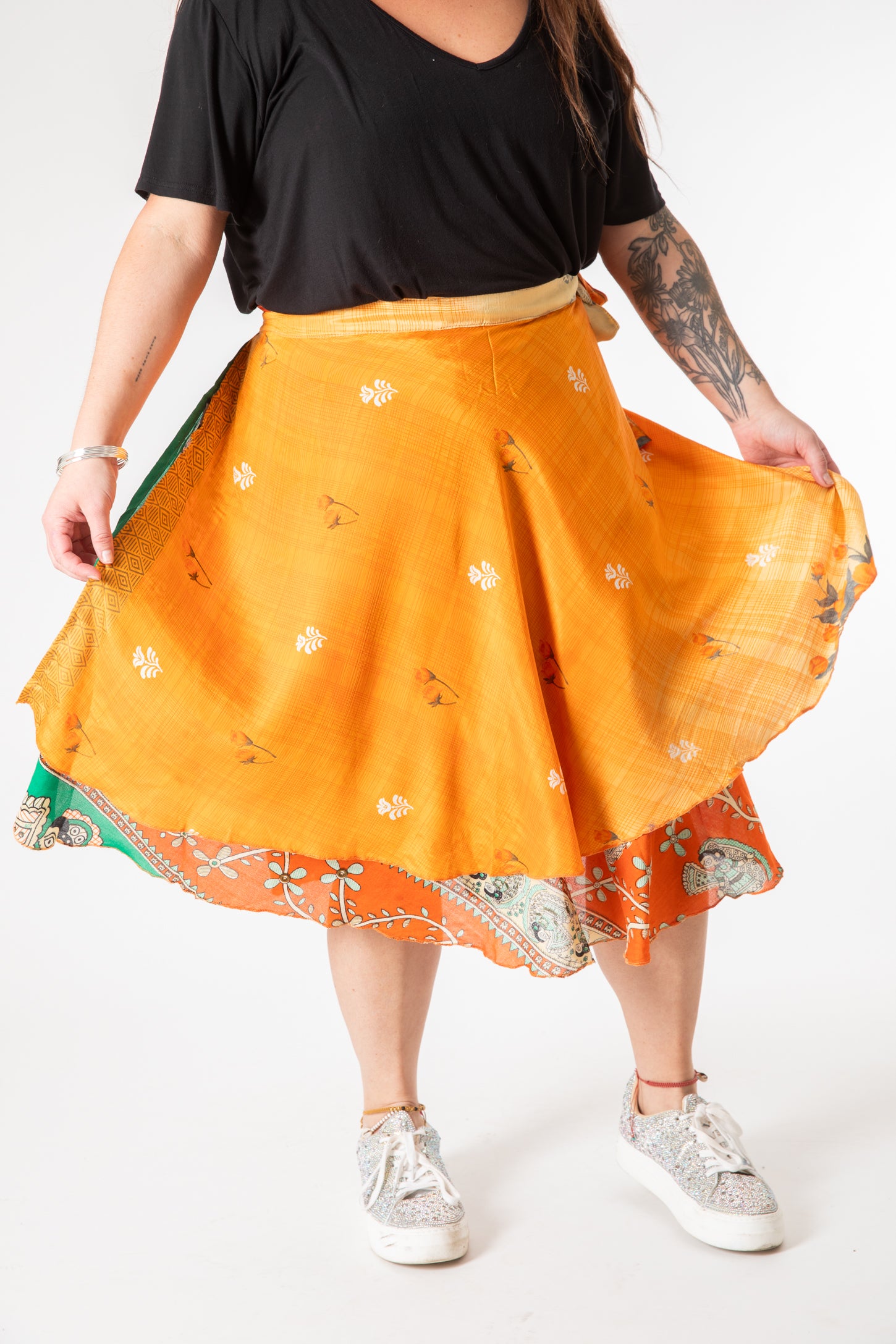 Desiree is wearing a silk wrap skirt in fire on the mountain