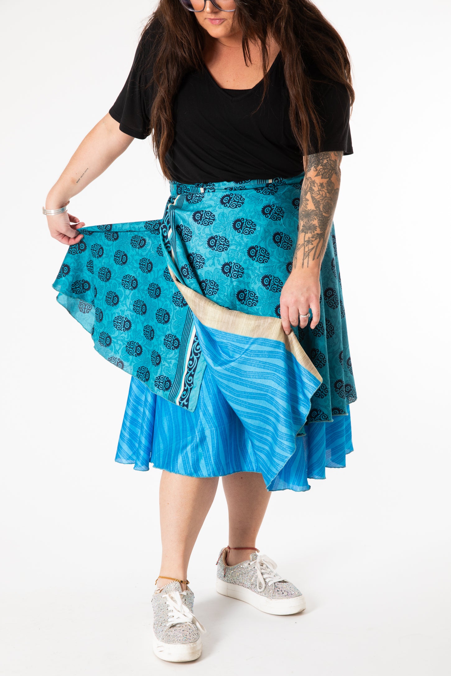 Desiree is wearing a silk wrap skirt in morning dew