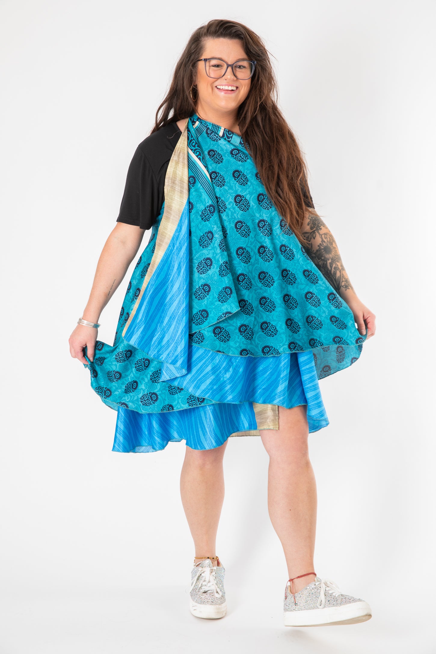Desiree is wearing a silk wrap skirt in morning dew