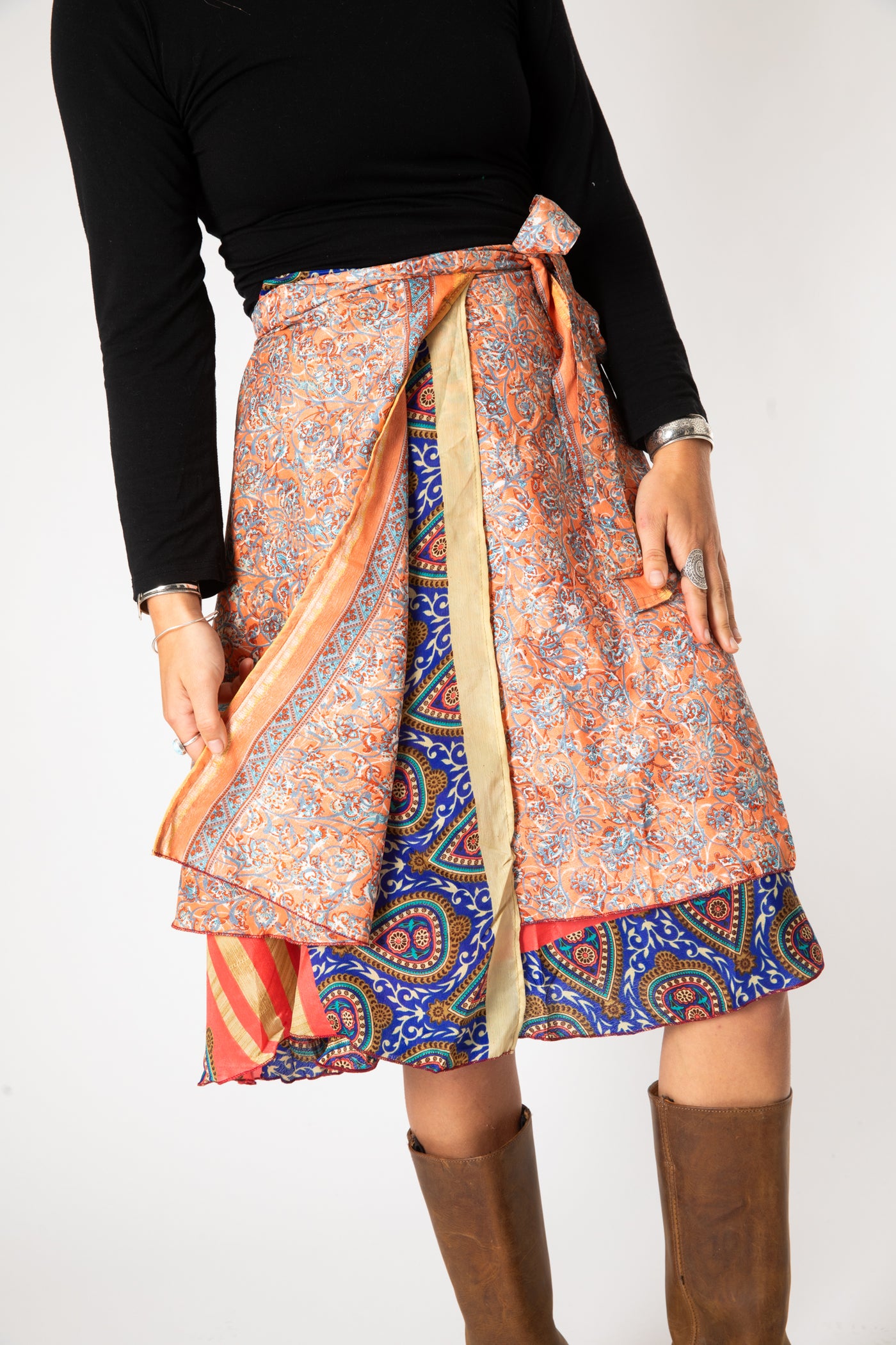Sophie is wearing a silk wrap skirt in sugar magnolia