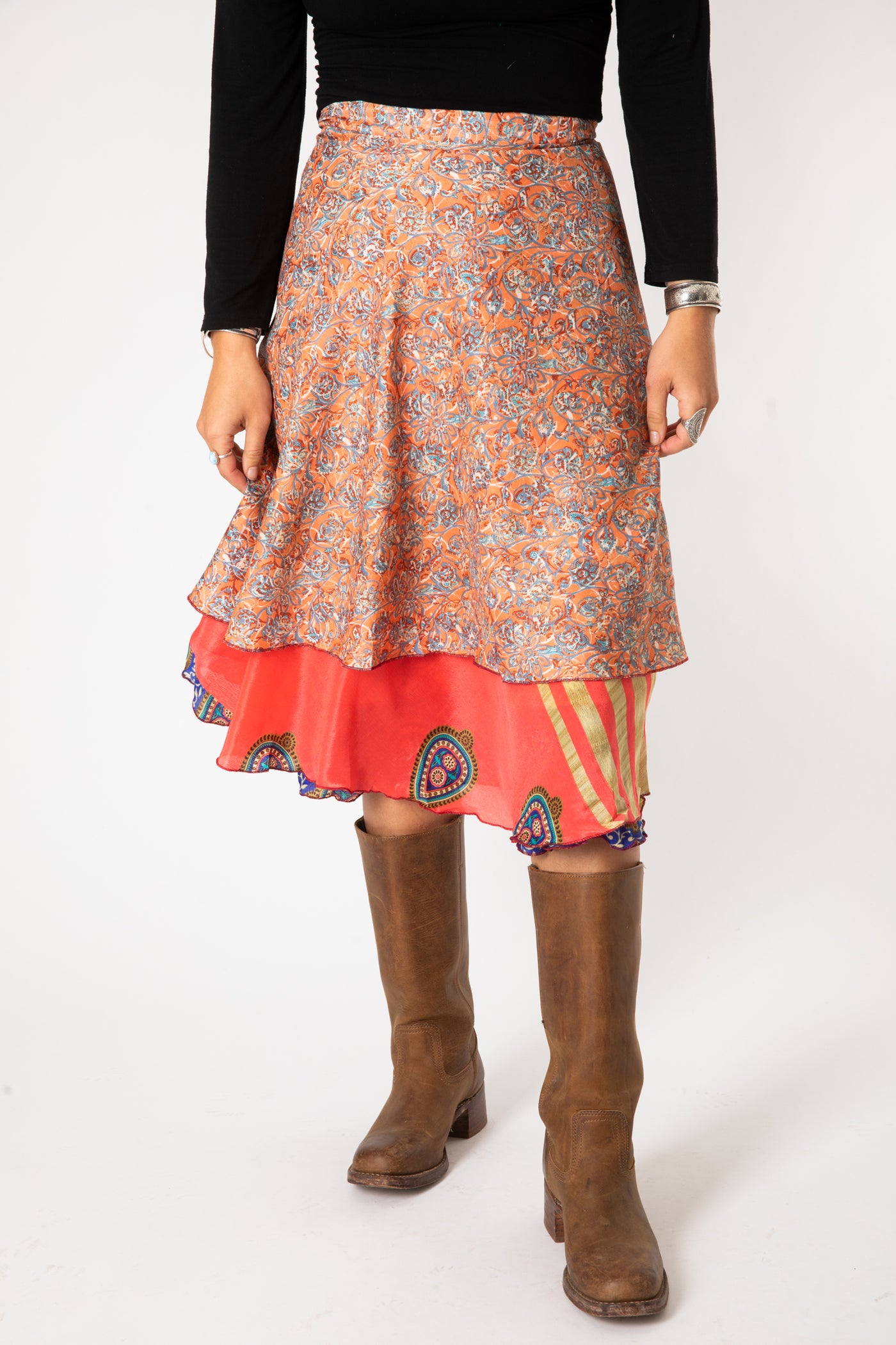 Sophie is wearing a silk wrap skirt in sugar magnolia