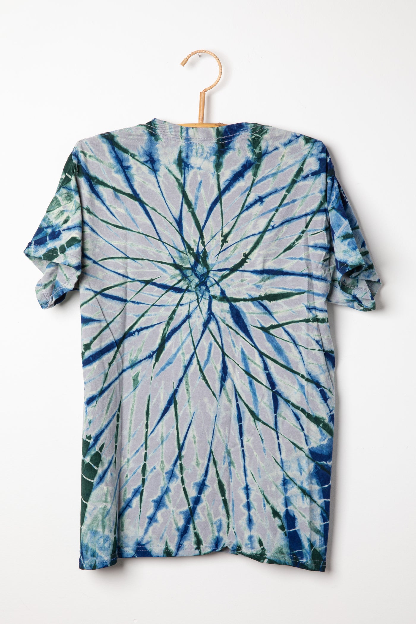 Tie-dye Charcoal with indigo and hunter colored t-shirt with a spiral pattern on a white background