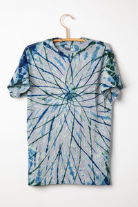 Tie-dye Charcoal with indigo and hunter colored t-shirt with a spiral pattern on a white background