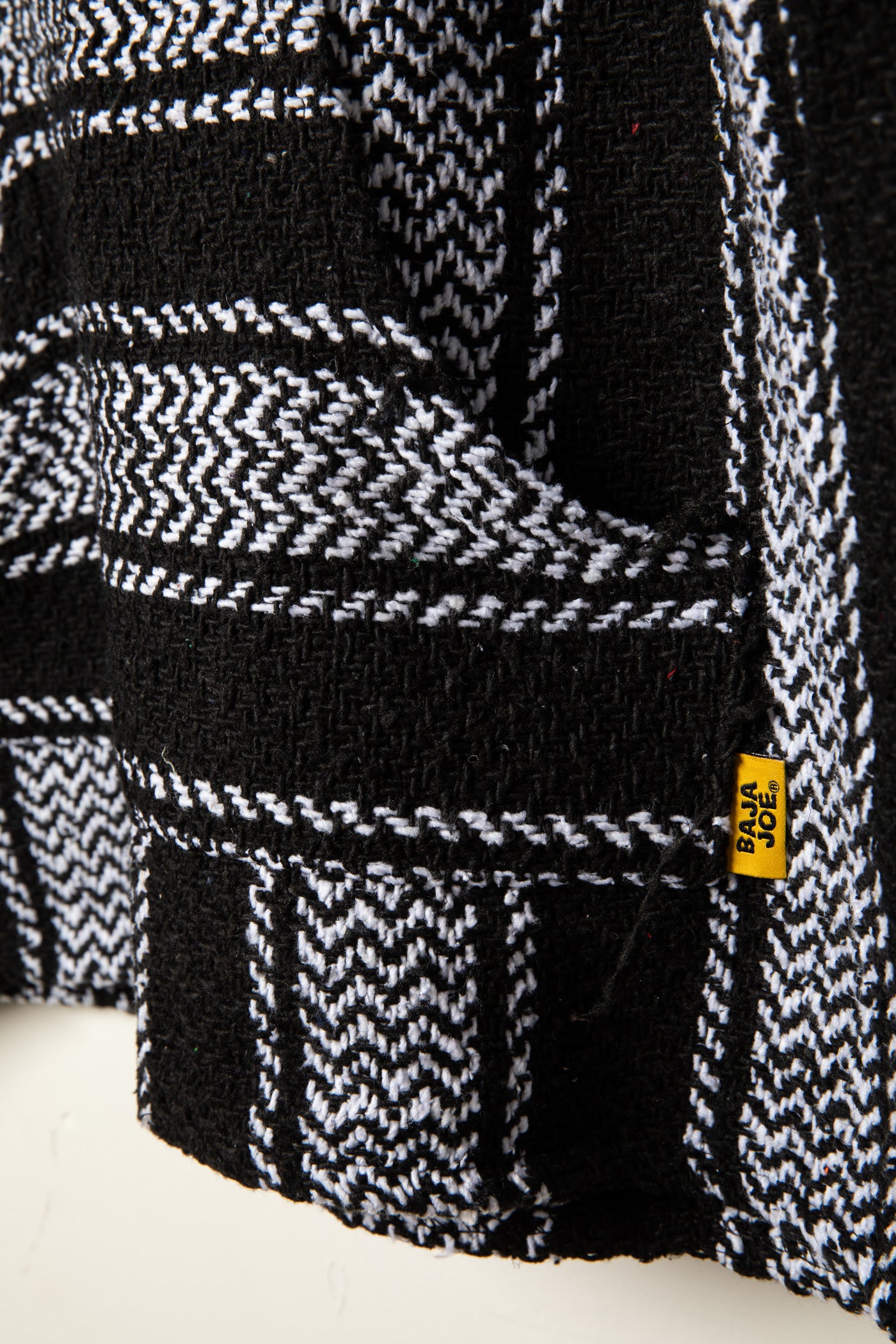 Recycled baja hoodie in Black detail of kangaroo pouch