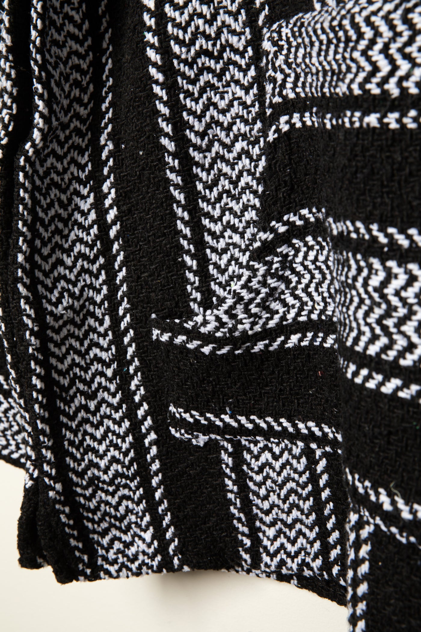 Recycled baja hoodie in Black detail of kangaroo pouch